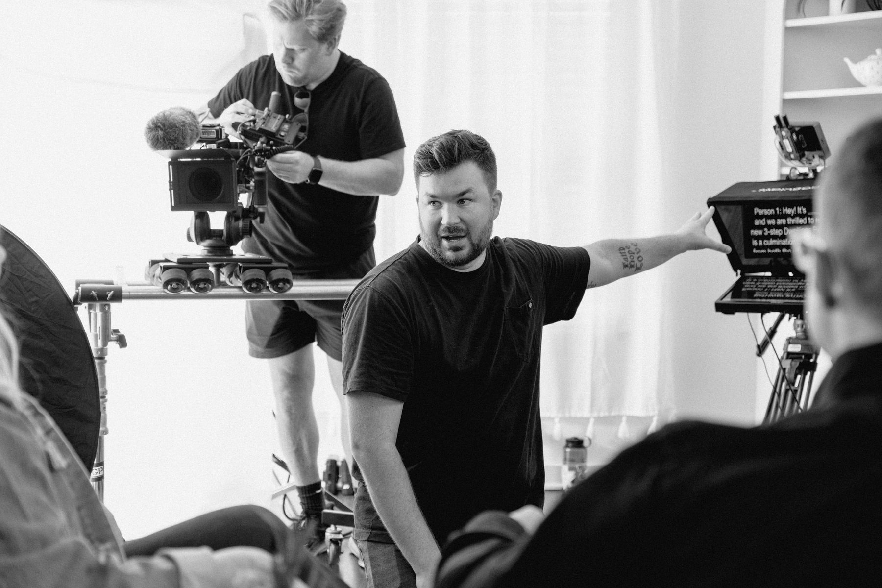 Director coaching on-camera talent during a corporate video shoot in Arkansas