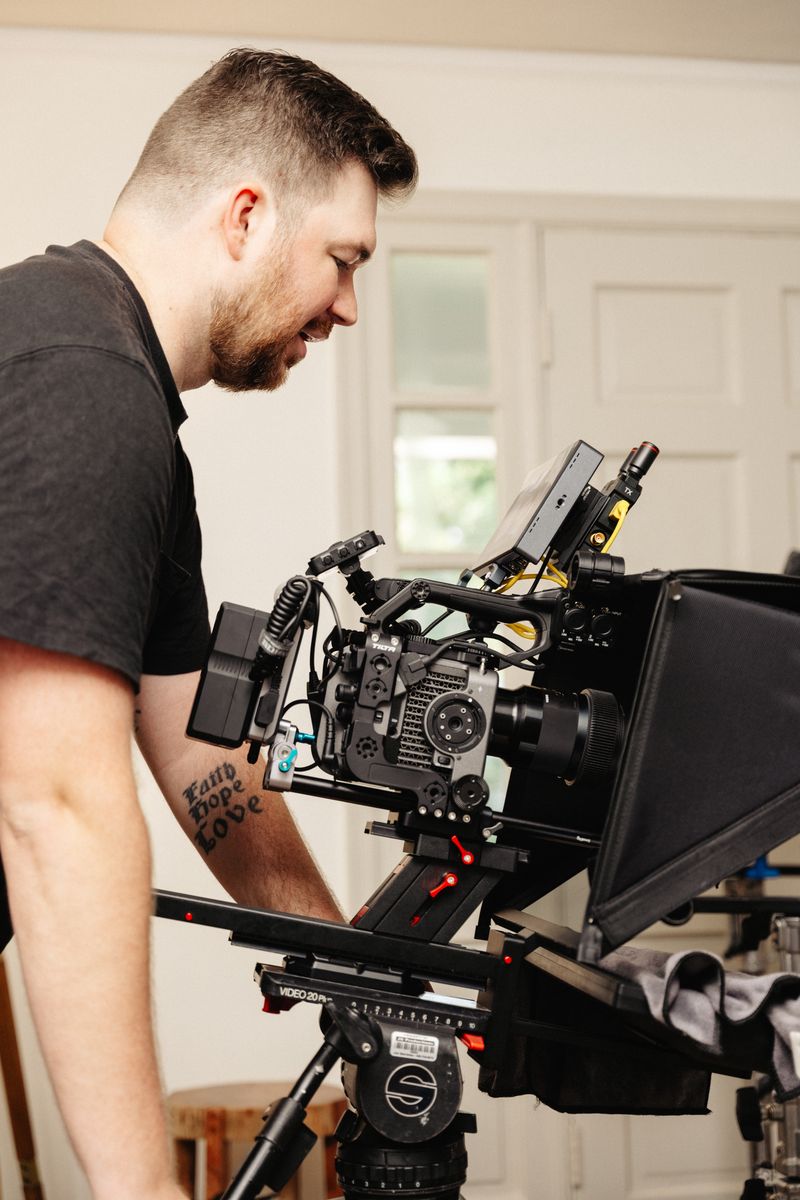 Wide view of a professional video production setup in Arkansas with cinema cameras on dollies and lighting